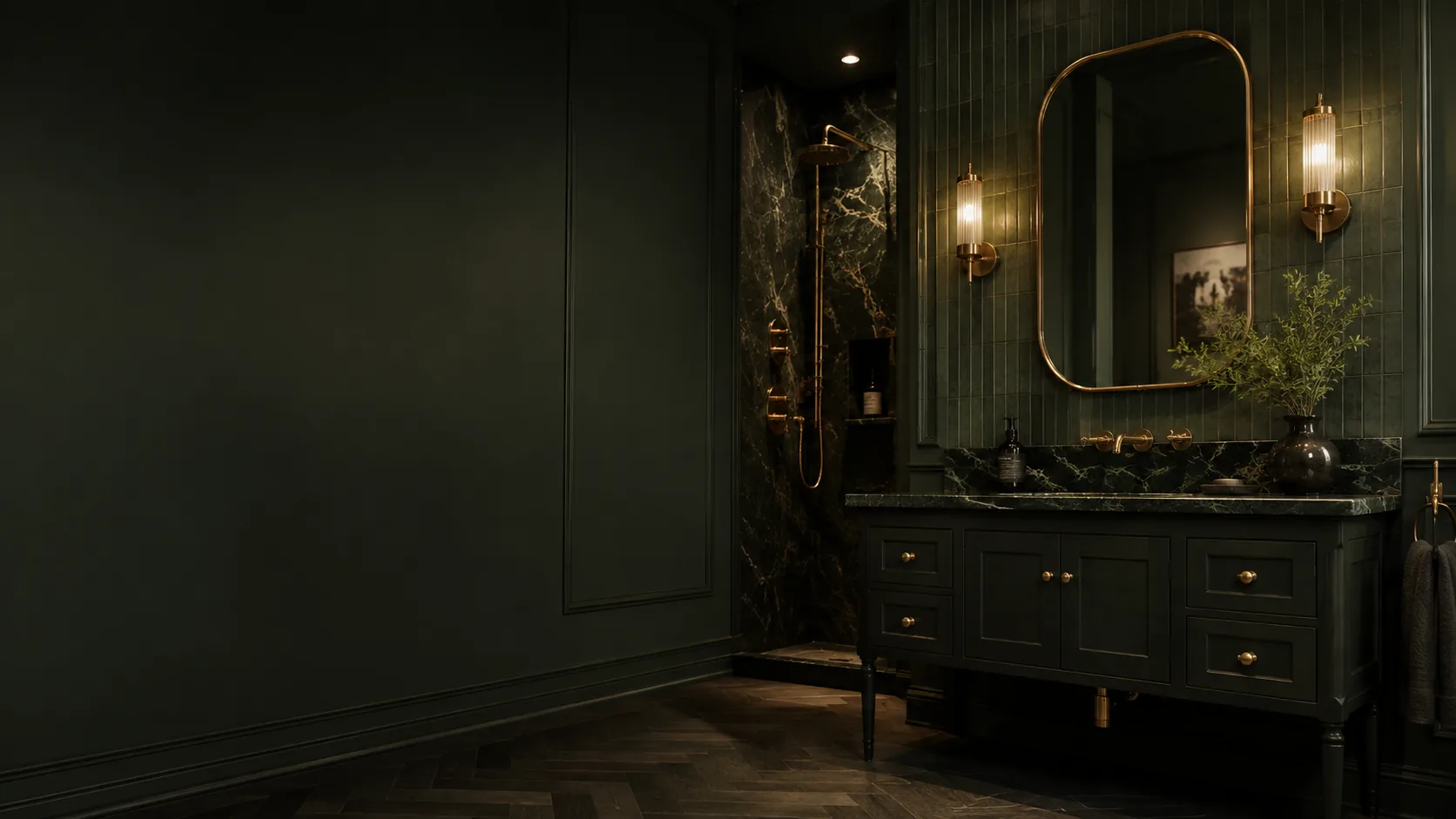 A dark green bathroom with brass fixtures and a marble shower